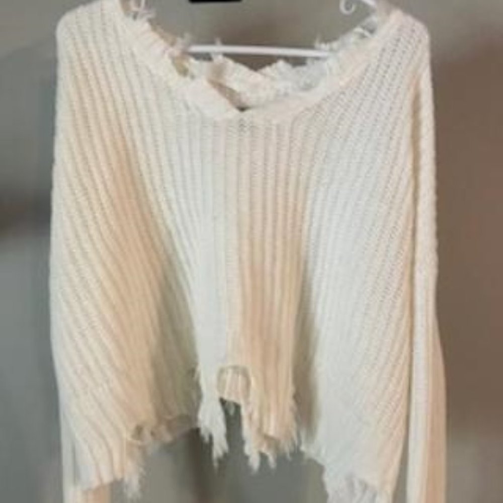Distressed crop sweater